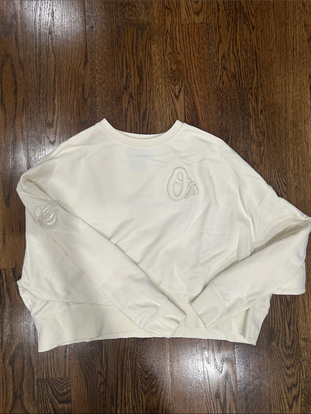 Baltimore Orioles Women's Cream Crewneck Crop Sweatshirt with Embroidered Logo